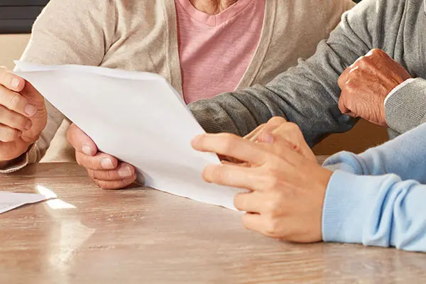 daughter helps seniors with guardianship or conservatorship document