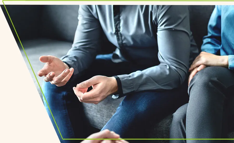 mediator or family counsel with couple in therapy meeting